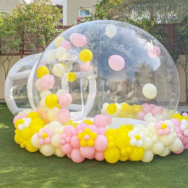 Clear inflatable bubble dome with pastel balloon garland