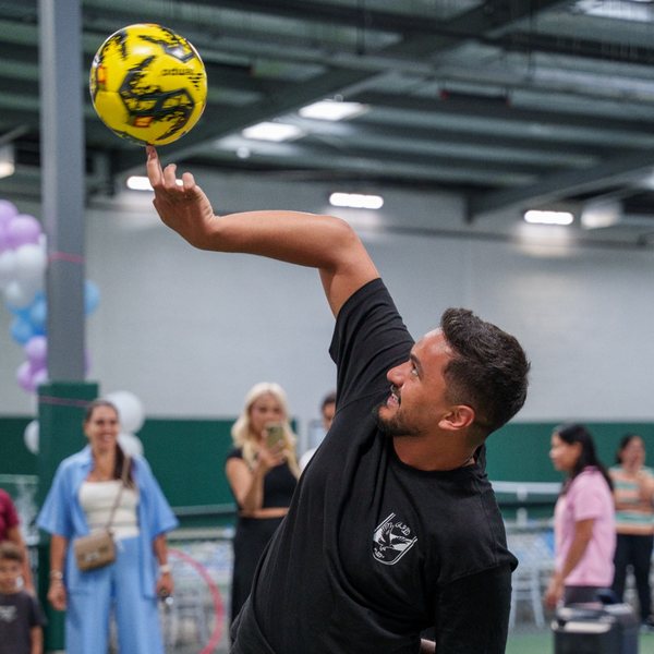 Freestyle football entertainer spinning a ball at a La Folie party