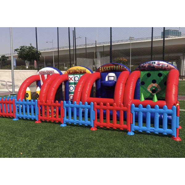 Four inflatable carnival game booths behind colourful fences