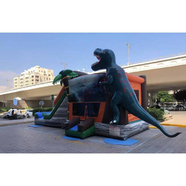 Dinosaur bouncy castle with a giant T-rex and a slide