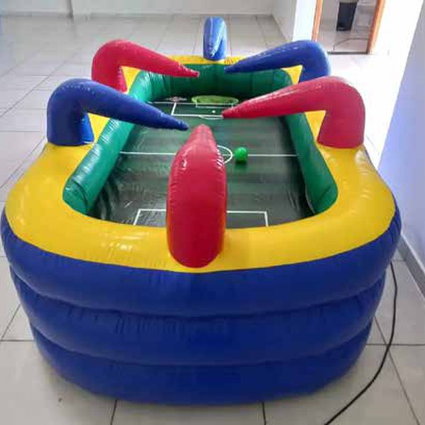 Inflatable foosball table in yellow, blue and red