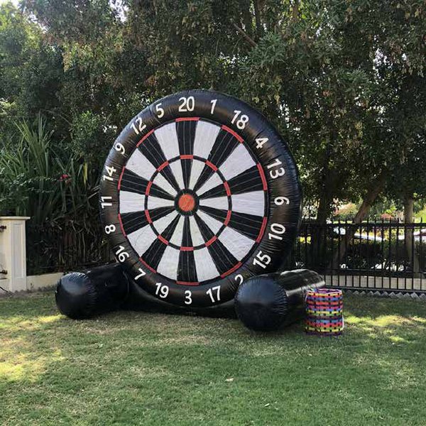Giant inflatable football dartboard in a garden