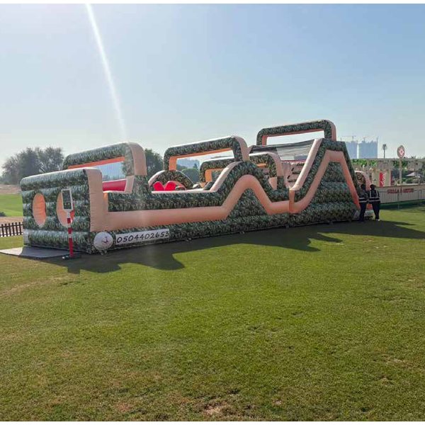Long inflatable Ninja Warrior obstacle course on a lawn